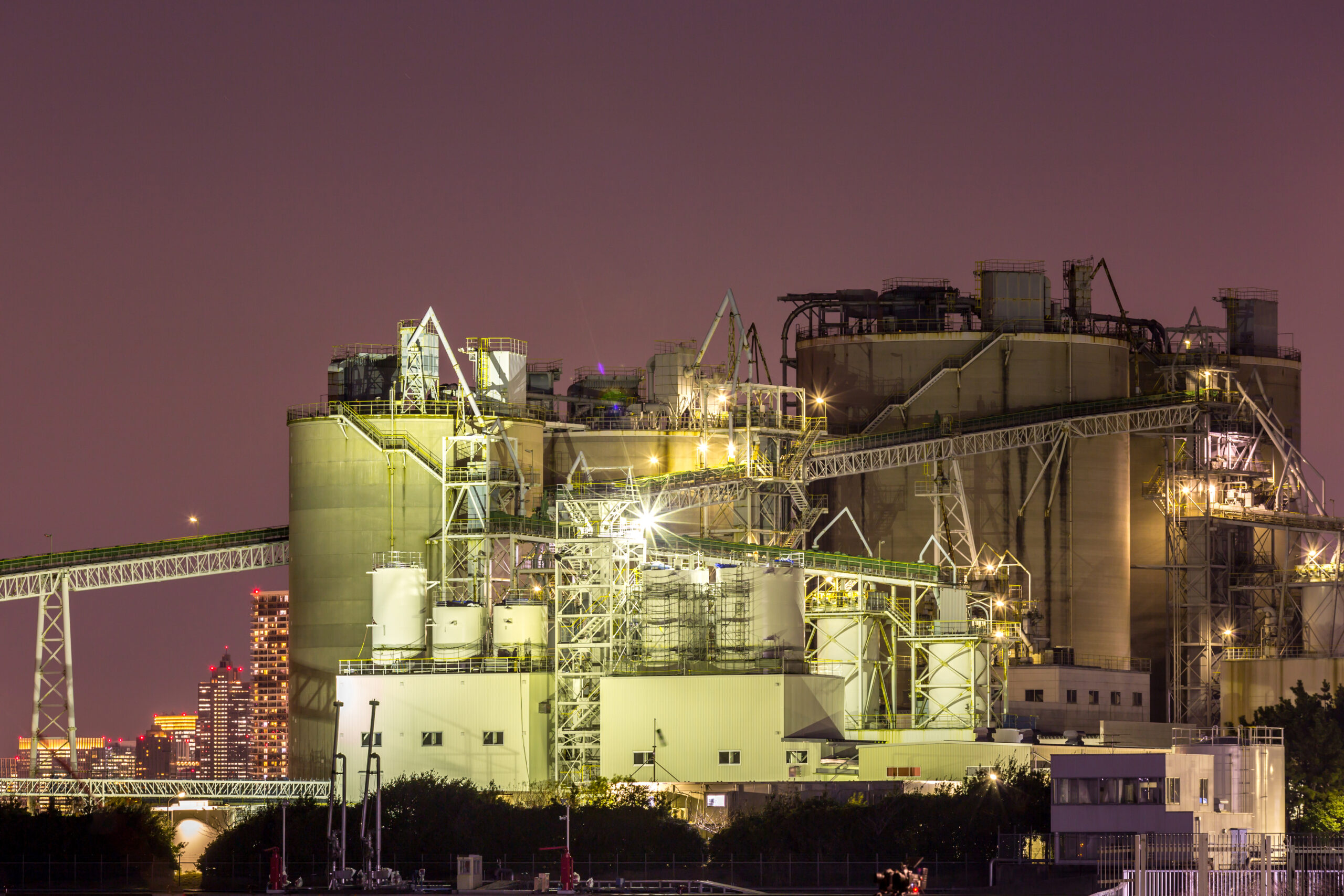 Big Industrial oil tanks in a refinery at night
